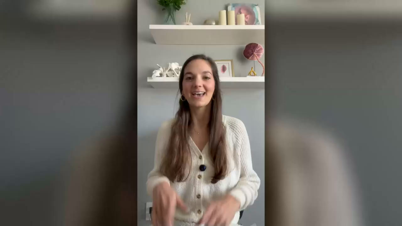 HeHe speaking to the camera in her teaching space